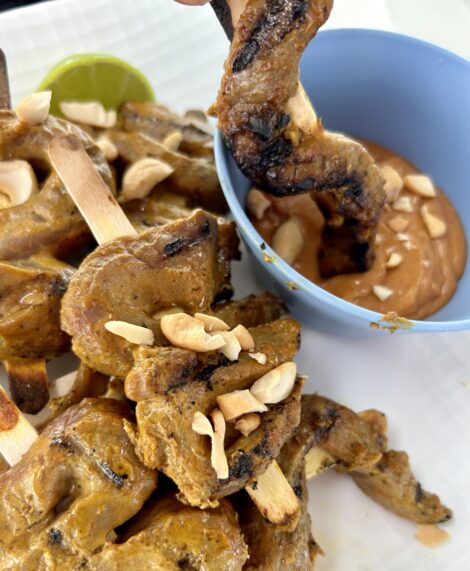Then top with chopped peanuts. Serve with peanut sauce and lime wedges.