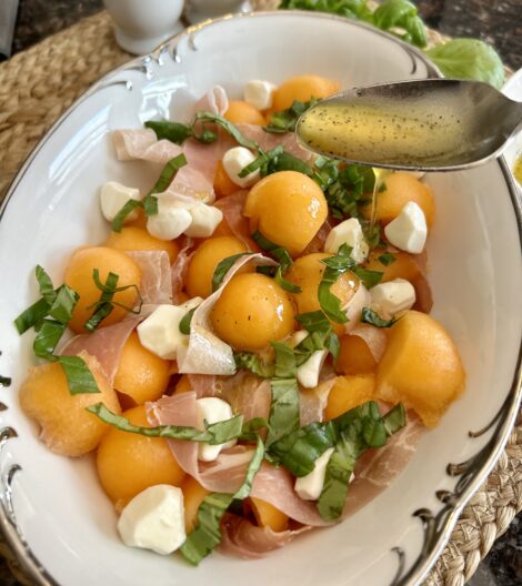 Add the dressing to the Cantaloupe Caprese Salad.