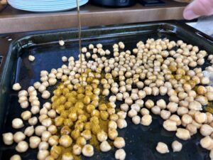 Drizzle the chickpeas with olive oil, then sprinkle them with the salt and curry powder. Gently toss to coat the beans.